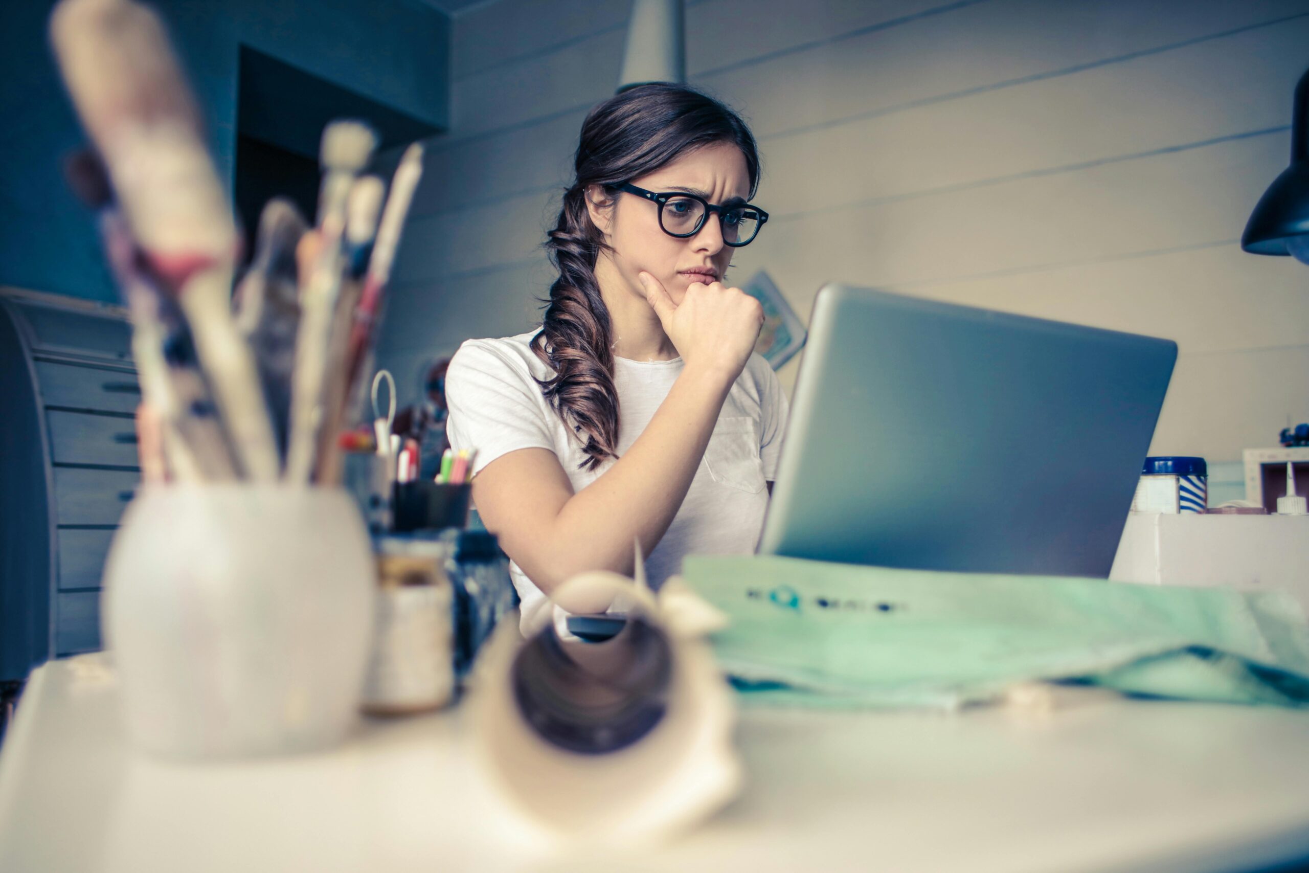 Focused woman working on laptop